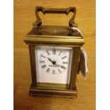 Miniature brass square carriage clock.