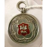 Sterling silver 1929-30 Norwich & District Football League medal. Red enamelled shield.