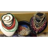 A quantity of costume jewellery necklaces to include vintage examples and faux pearls.