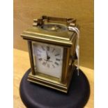 Miniature brass square carriage clock.