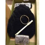 Vintage art deco black velvet evening bag together with a carved ivory claw cigarette holder, art