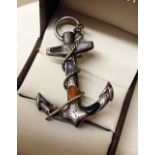 An engraved silver anchor brooch inlaid with agate stones (some damage to stones). No hallmark tests