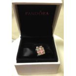 Pandora "All wrapped up in Pandora" charm, sterling silver with pink enamel in original box.