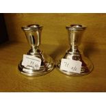 Pair of hallmarked silver candle holders, Birmingham 1972, approx 3.5" tall.