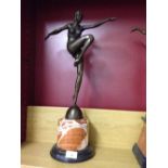 Art Deco style bronze lady figure on a round marble base.