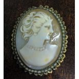 A Victorian carved cameo brooch/pendant in a decorative mount edged with seed pearls.