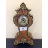 A Victorian gilt and burr walnut mantle clock, possibly French, in working order.