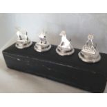 A cased set of 4 silver place card menu holders in animal forms, Birmingham 1908.