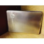 A HM silver cigarette case with Art Deco decoration to front on engine turned background. Approx