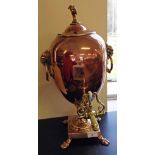 A Victorian copper & brass samovar by JS Pyrke & Sons, London with goats head finial, cloven feet