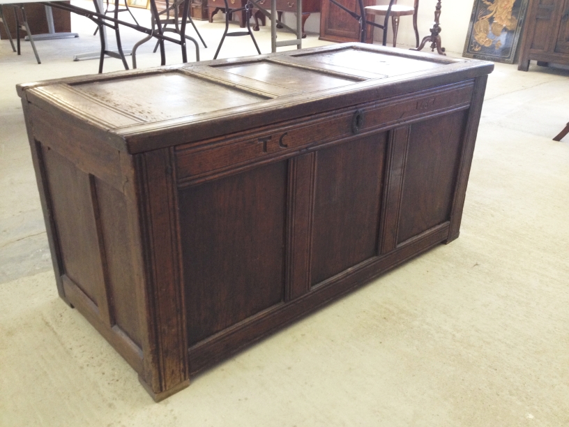 A 17th century antique oak coffer/blanket chest inscribed TC 1687.