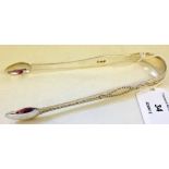 A pair of silver Georgian bright out sugar tongs, London 1791. Makers mark IG.