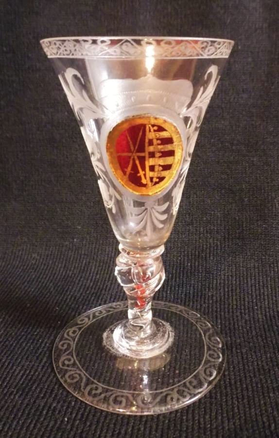 A 18th century Silesian wine/sherry glass c1720 with a ruby glass zwischengold medallion bearing the