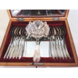 12 Dutch silver tea spoons with tea strainer in mirror lined birds eye maple box, c1843.