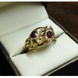 Antique 9ct gold twin headed serpent ring set with 2 0.3ct rubies. Hallmarked Chester 1914. Maker