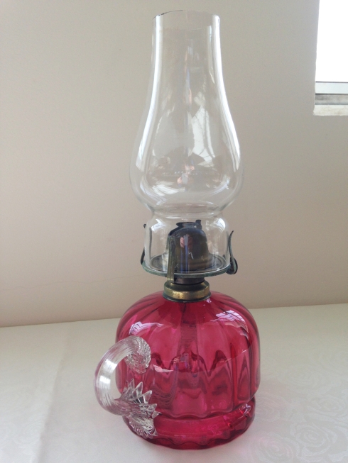 An antique cranberry glass hand held oil lamp. - Image 2 of 2