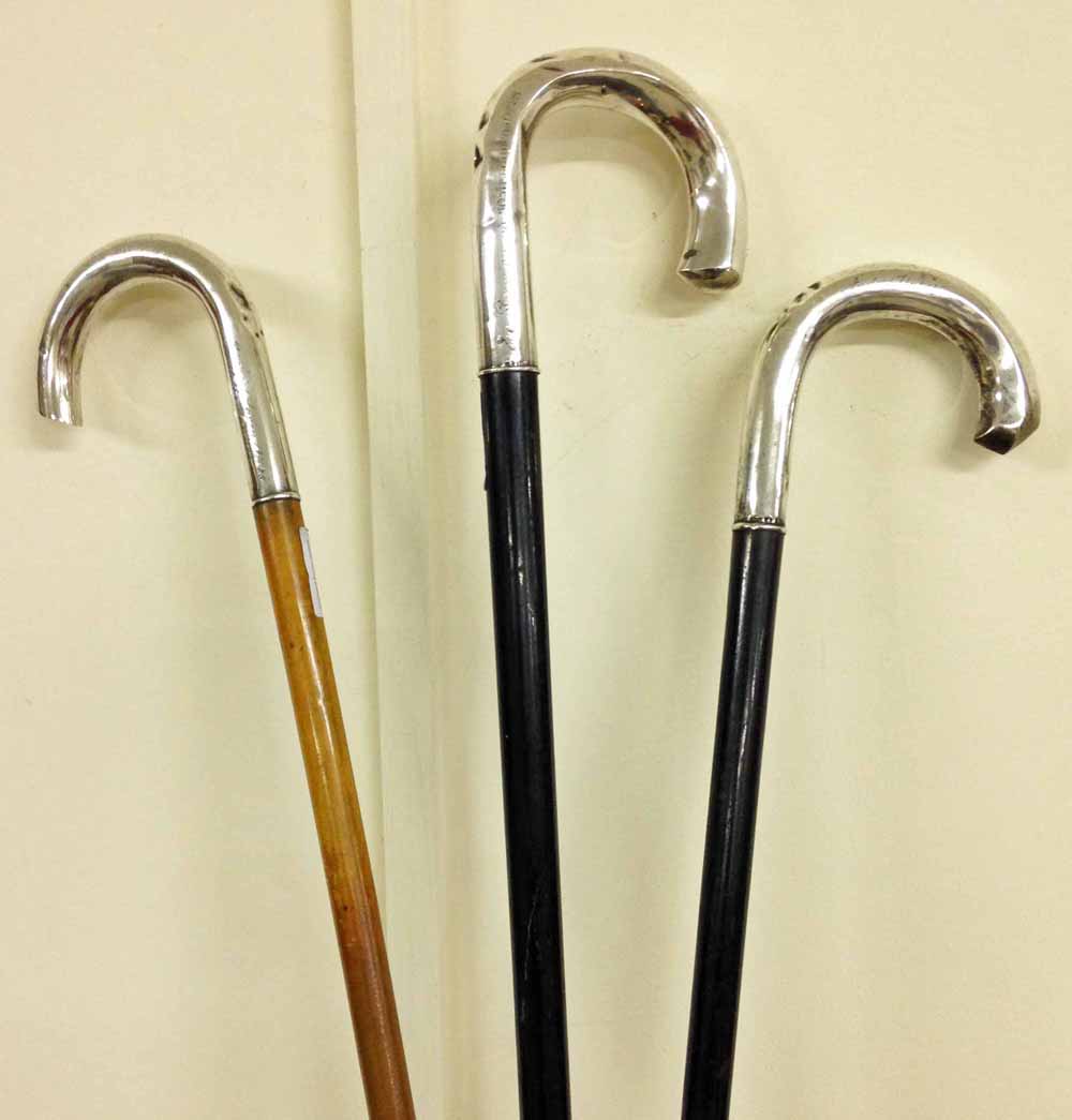 3 continental early 20th century walking sticks with continental silver handles.