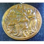 A heavy antique brass round plaque tavern scene, 16cm diameter