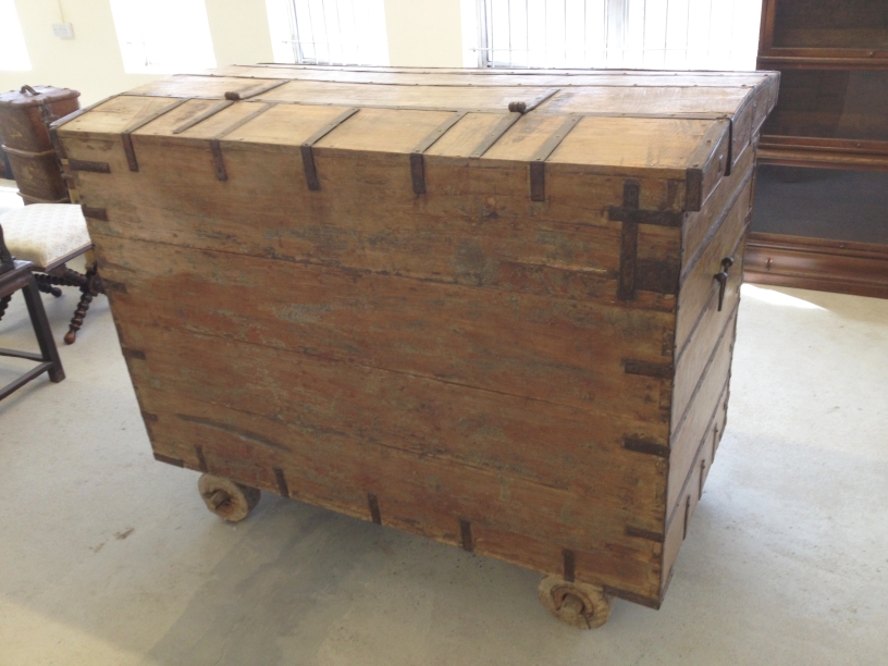 A very large antique Indian/African iron banded wooden marriage chest on wheels - measures 158 x