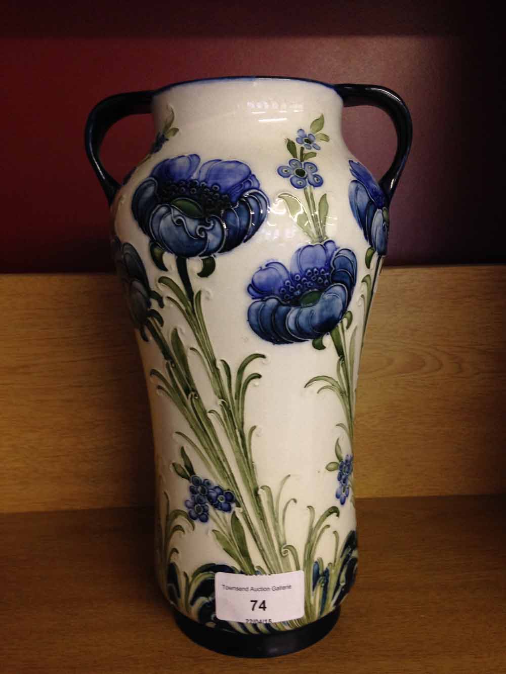 A William Moorcroft McIntyre two handled vase Florian ware Blue Poppy pattern. 24cm tall. We believe - Image 2 of 2