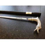 A 19th century sword stick with pewter/white metal dolphin shaped handle.