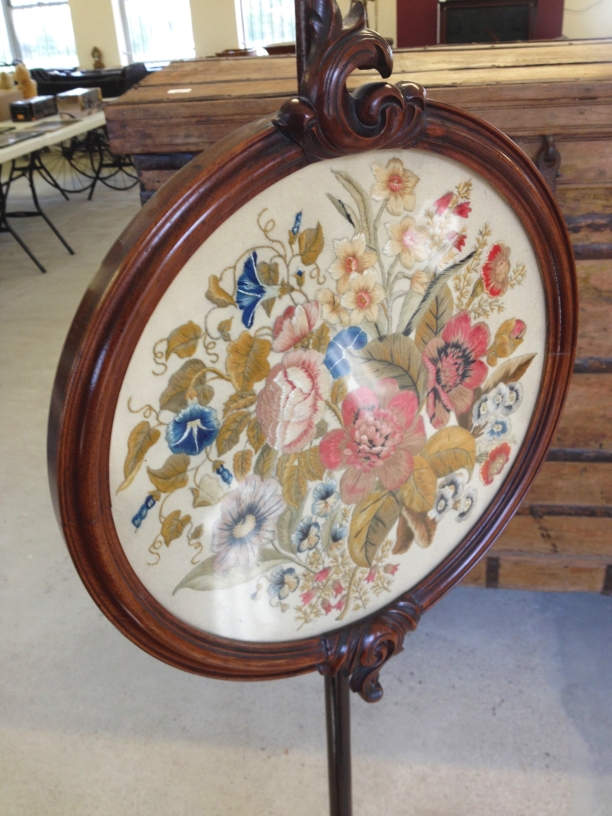 A Victorian pedestal face/fire screen with intricate hand embroidered circular panel in excellent