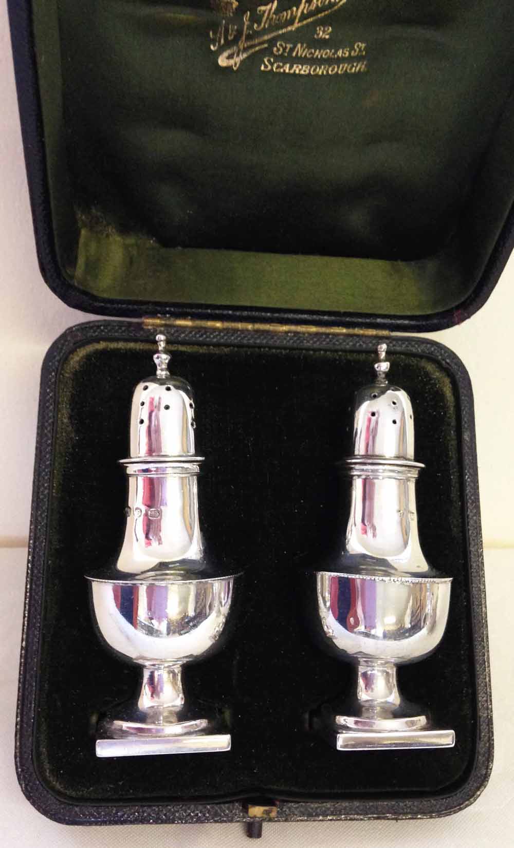 A cased pair of silver pepper casters, Birmingham 1873. Approx 76g. - Image 2 of 2