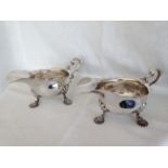 A matched pair (same maker) of George II style silver sauce boats on shell feet, Sheffield 1898 &