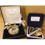 A Danbury mint boxed pocket watch with boxer dog enamel design together with a stags head and purple