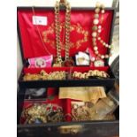 A box of costume jewellery to include a 9ct front & back locket.