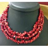 3 string polished red agate necklace.