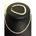 A freshwater pearl necklace and a pearl bracelet.