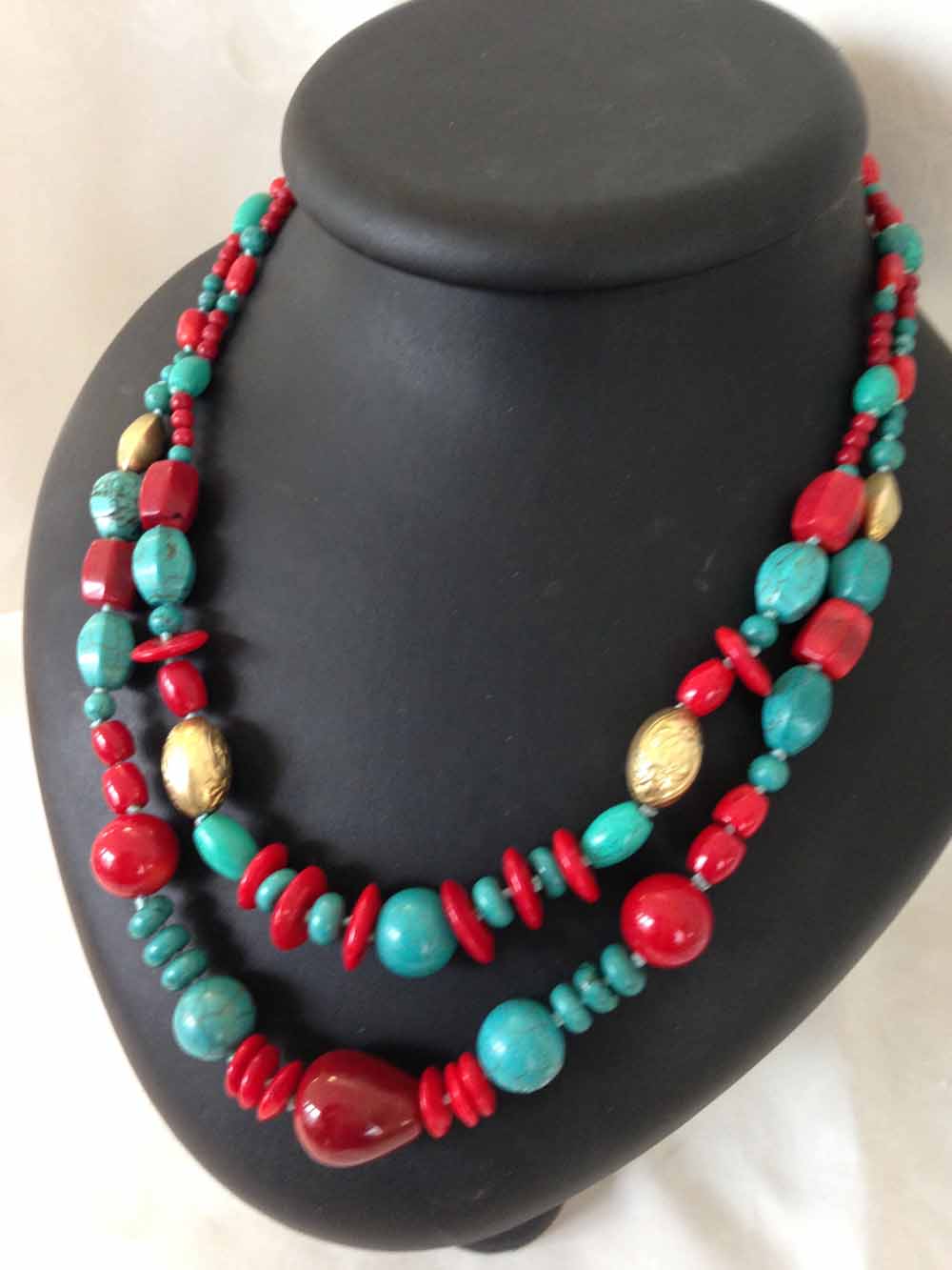 2 string turquoise & red spinel necklace interspersed with 4 gold coloured beads.  Beads of