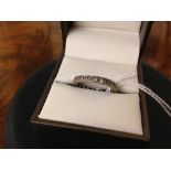 A 9ct white gold eternity ring set with white stones, Size N. Total weight approx 2.5g