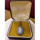 A boxed Wedgwood blue jasperware pendant in a silver oval mount on a silver chain. 16 Inch.