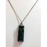 A silver mounted green carved verdite oblong agate on a silver chain. 18 inches.