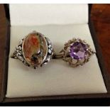 2 ladies silver dress rings each with ornate mounts and set with stones - one size L, the other size