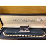 A boxed set of Dynasty simulated pearls.