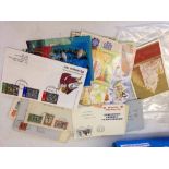 A collection of postcards, 1930s stamped envelopes & first day covers.