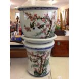 A chinese jardiniere with bird and prunus decoration