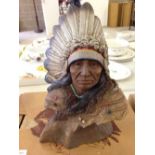 A boxed Limited Edition JH Boone Native American Indian warrior figure 'Running Coyote'. 20cm tall