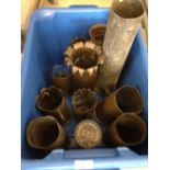 A box of spent WW1 brass shell casings.