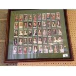 A framed & glazed set of 50 Players' cigarette cards. 'Kings & Queens of England' issued in 1935.