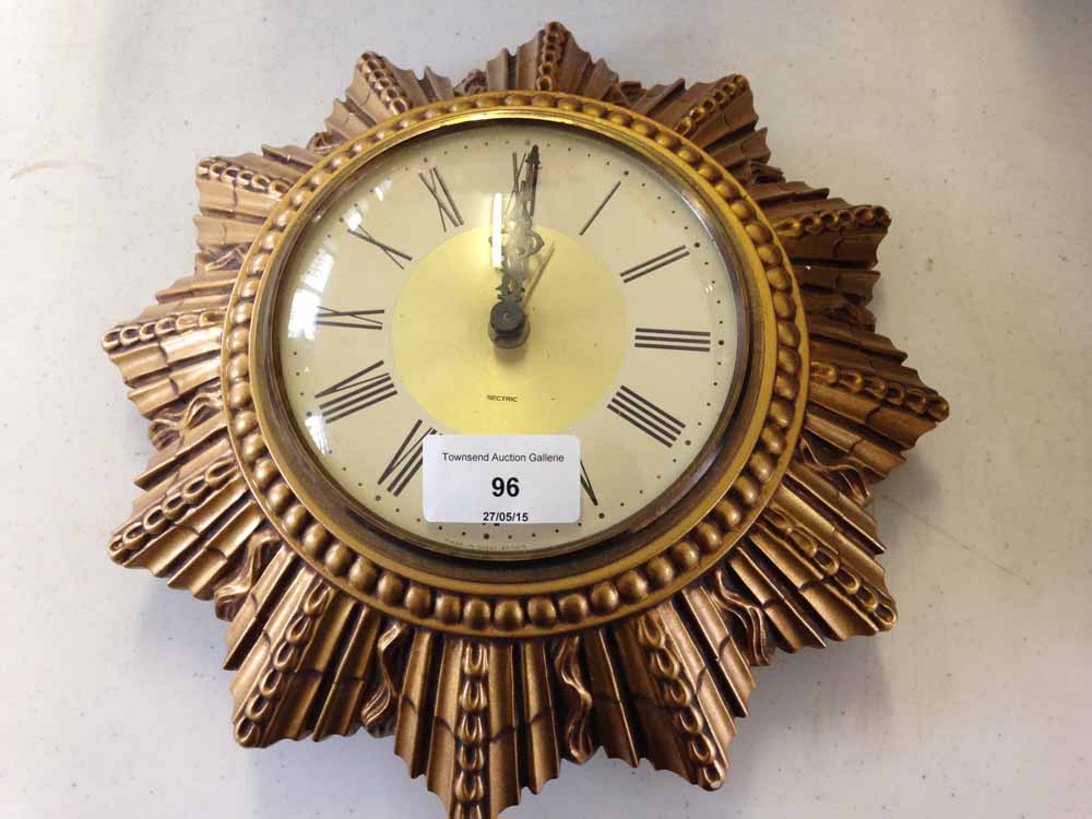 A Smiths sectric clock in gilt sunburst mount.