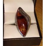 925 silver & amber ladies dress ring, with elongated design measuring approx 3.5cm long. Size approx