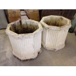 A pair of large concrete octagonal planters approx 54cm diameter & 51cm tall.