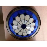 A blue & white Tiffany style lamp shade.