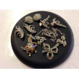 A collection of marcasite jewellery: 3 pairs of clip on earrings, a necklace and a donkey brooch.