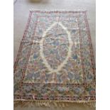 An Eastern pattern woolwork rug/wall hanging. Approx 180 x 118cm.