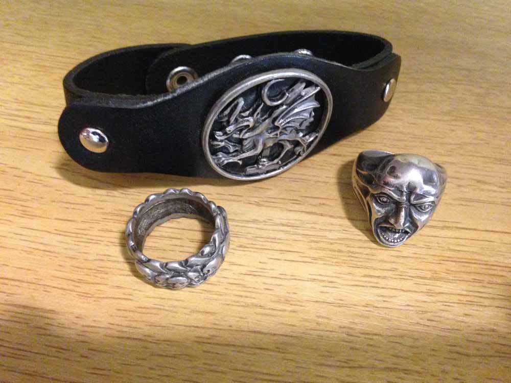 3 Gothic items of jewellery - 2 rings and a leather armlet.